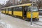 Ice-covered tram is waiting new passengers to come on a stop in the Dnepropetrovsk city at cold winter day