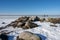 Ice covering an ocean bay. People enjoy the Sunday outing by walking and skating on the ice. Picture from Lomma, Sweden