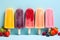 Ice cream bars in a variety of colors, bright, lively, and delicious, along with a variety of fruits. On a pastel blue background