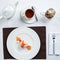 Ice cream beautifully decorated on a white plate