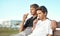 Ice-cream can turn any frown upside down. two happy brothers eating ice-cream cones while sitting on a bench by the