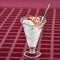 Ice cream with cherries and fillings on the table