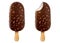 Ice cream with chocolate glaze and nuts on a stick. Brown whole and bitten chocolate ice cream popsicle with peanuts isolated on