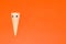 ice cream cone with eyes on the left side of orange background, creative summer design