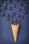Ice cream cone filled with blueberries