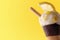 Ice cream cone flavored lemon yellow background