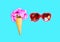 Ice cream cone with flowers and red sunglasses heart shape