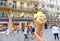 Ice cream cone in hand, on the blurred background of a crowded street in Vienna
