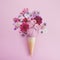 Ice cream cone with Icse cream and flowers. Spring and summer Floral style. Flat lay