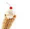 Ice cream cone with maraschino cherry