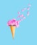 Ice cream cone with petals flowers over blue background