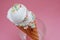 Ice Cream cone with scoop of Vanilla ice cream in glass on Pink background. top view. Party, dessert, summer concept.