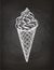 Ice cream cone sketch on chalkboard.