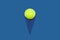 Ice cream cone with tennis ball on bright blue background. Minimal concept