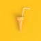 Ice cream cone with white drinking straws abstract minimal yellow background, Food concept