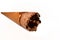Ice cream of creamy cocoa chocolate cone with topping of chocolate chips pieces in a crispy wafer cones, selective focus of
