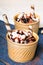 Ice cream in a cup with chocolate sauce cream rolls