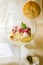 Ice cream dessert in a glass with amaretti biscuit