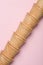 Ice cream empty wafer cones tube on pink background