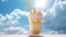 Ice cream exotic milkshake front of blue sky. Summer holiday fresh frozen dessert in glass. Vanilla mango cream with