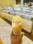 Ice cream flavor white chocolate frozen dessert pattern in waffle cone hand holding on table