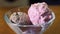 Ice cream in the form of colorful balls. One serving of assorted ice cream in a clear bowl.