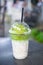 Ice cream green tea float on fresh milk in plastic glass