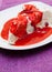 Ice cream meringue cake with strawberry topping