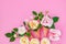 Ice cream from peony flowers in a waffle cone on a pink background from above, beautiful floral arrangement, vintage color, flat