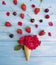 Ice cream rose strawberry cherry composition blueberry decorative on colored wooden background
