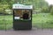 Ice cream salesman in london st james`s park and paople sitting