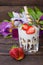 Ice cream with strawberries, mint and muesli. Wooden rustic table.