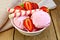 Ice cream strawberry in bowl with wafer rolls