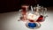 Ice cream with syrup in a glass bowl on a light table, next to a tea punch.