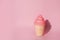 Ice cream toy made from plastic on pink background with copy space
