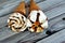 Ice cream vanilla cones with topping of chocolate and caramel sauce and nuts in a crispy wafer cones, selective focus of melting