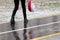 Ice crusted ground, a girl walking on a slippery street