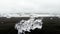 Ice crystals, melting icebergs and black volcanic sand on Diamond beach, Jokulsarlon, Iceland