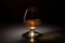 Ice cube fall and splash in beautiful glass goblet