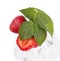 Ice cube and strawberry on a white background