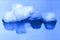 Ice cubes on blue reflective surface