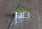 Ice cubes and nettle leaves on wooden background