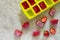 Ice cubes with strawberries on a brown stone background. Strawberry for cooking a refreshing summer drink