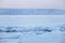 Ice-drift on Lake Baikal, winter. Sunset landscape.