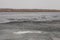 Ice drift on river. River opening itself up from ice. Problem of melting glaciers as result of global warming, emergency