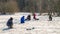 Ice fishing. Anglers catching fish in early spring on the last ice. Zaslavl water reservoir