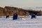 Ice Fishing Huts On A Frozen Canadian Lake