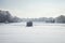 Ice fishing shacks at Minnesota lake on a bright winter morning