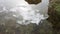 An ice floe floats on a puddle and melted snow. The beginning of spring, close-up