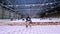 Ice hockey goalkeeper standing at the gate during a hockey match on the ice. Slow motion